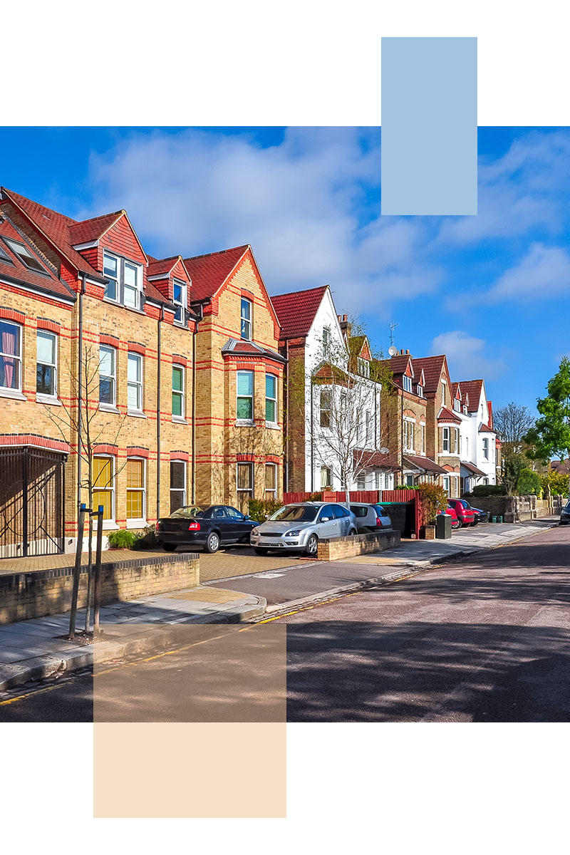 Period houses with dormer roofs on a residential street