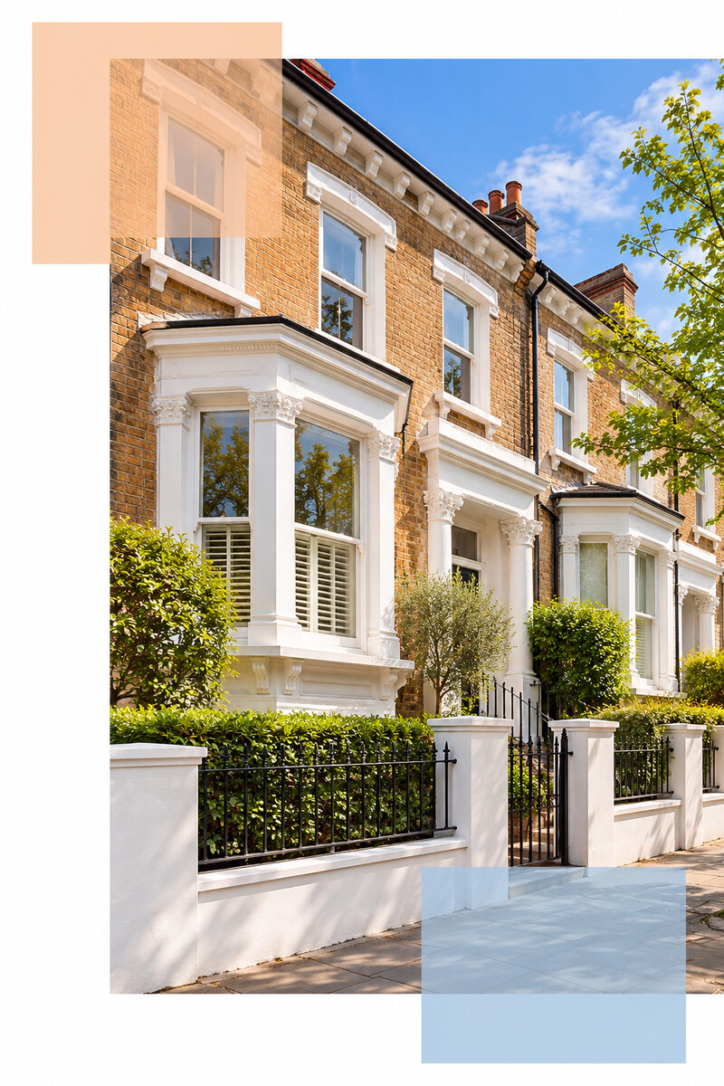 Victorian terraced house exterior with white bay windows