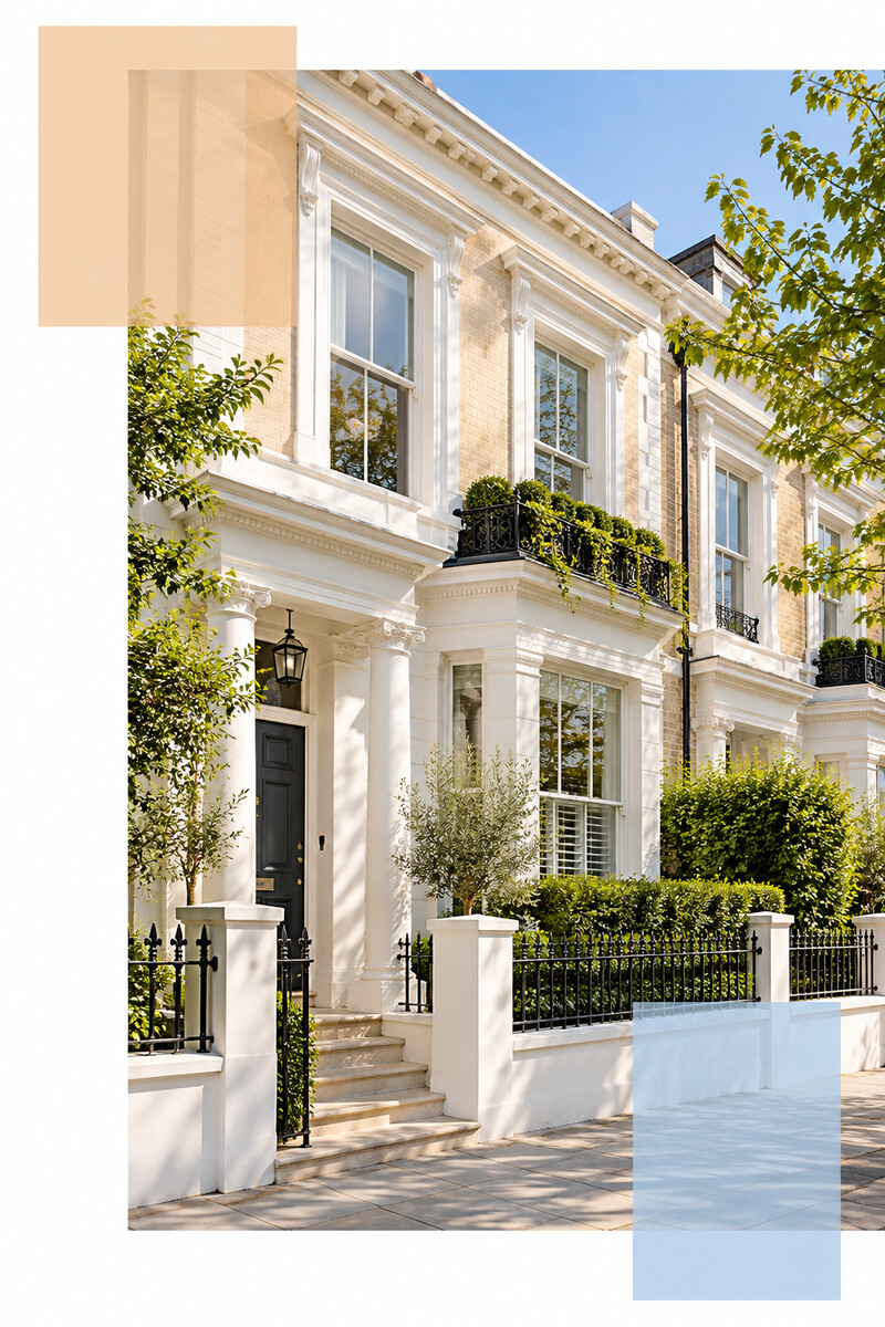 Light-coloured period townhouse exterior with iron railings and greenery